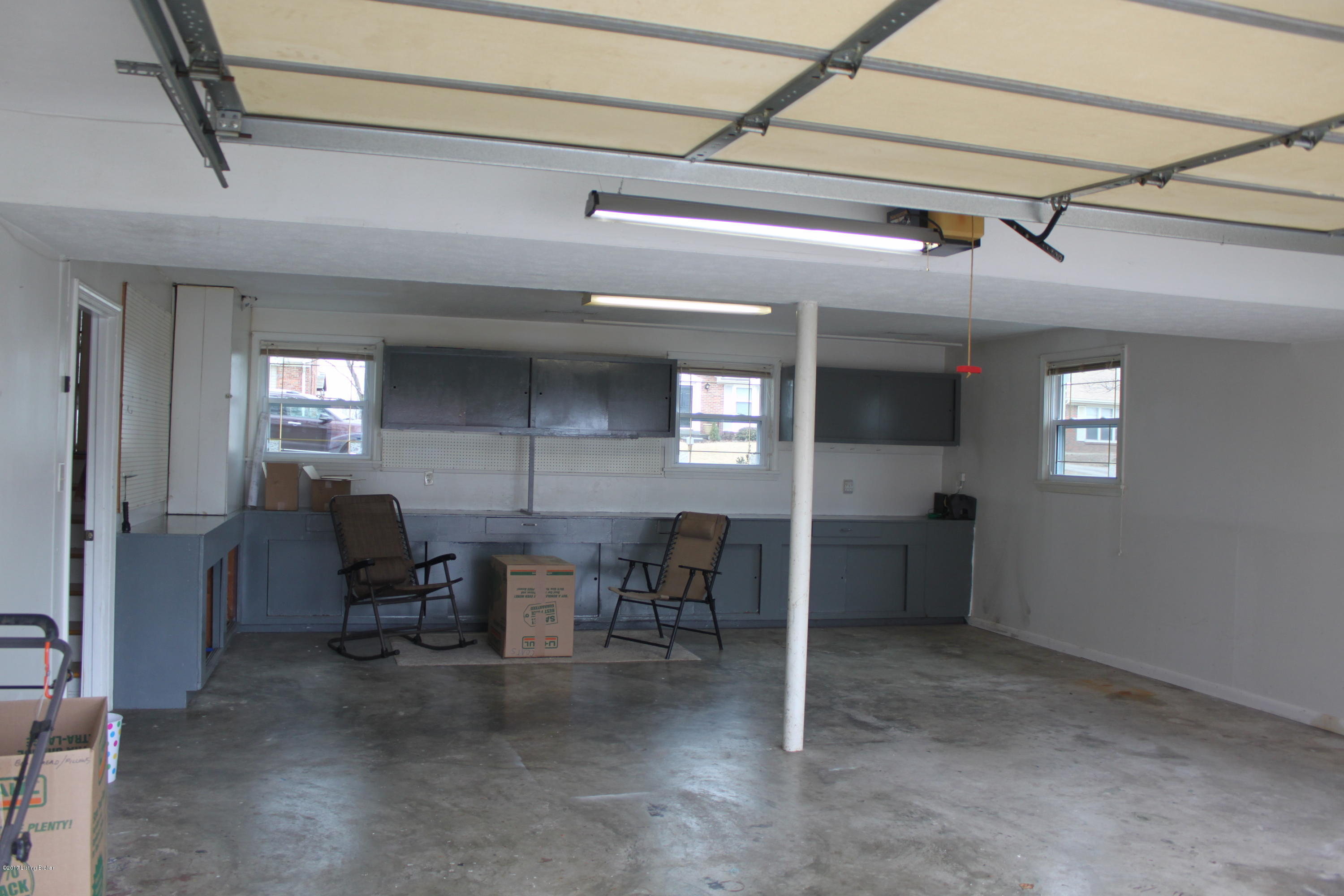 6507 Ridge Cliff Road Hollow Creek, KY 40228 - Photo 26 of 31 Garage with Workbench and cabinets