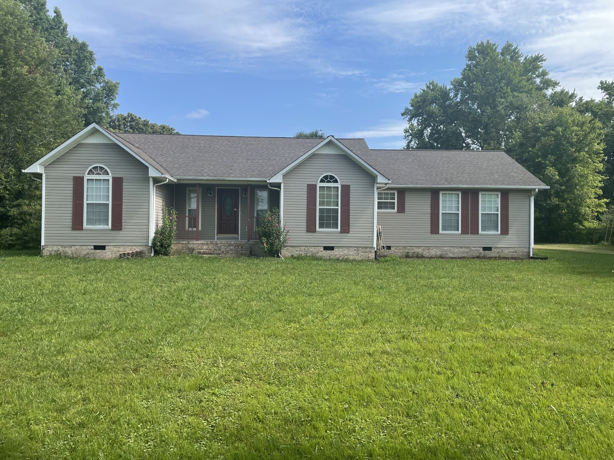 1799 Ragsdale Road Manchester, TN 37355 - Photo 1 of 17 a front view of a house with a garden and trees
