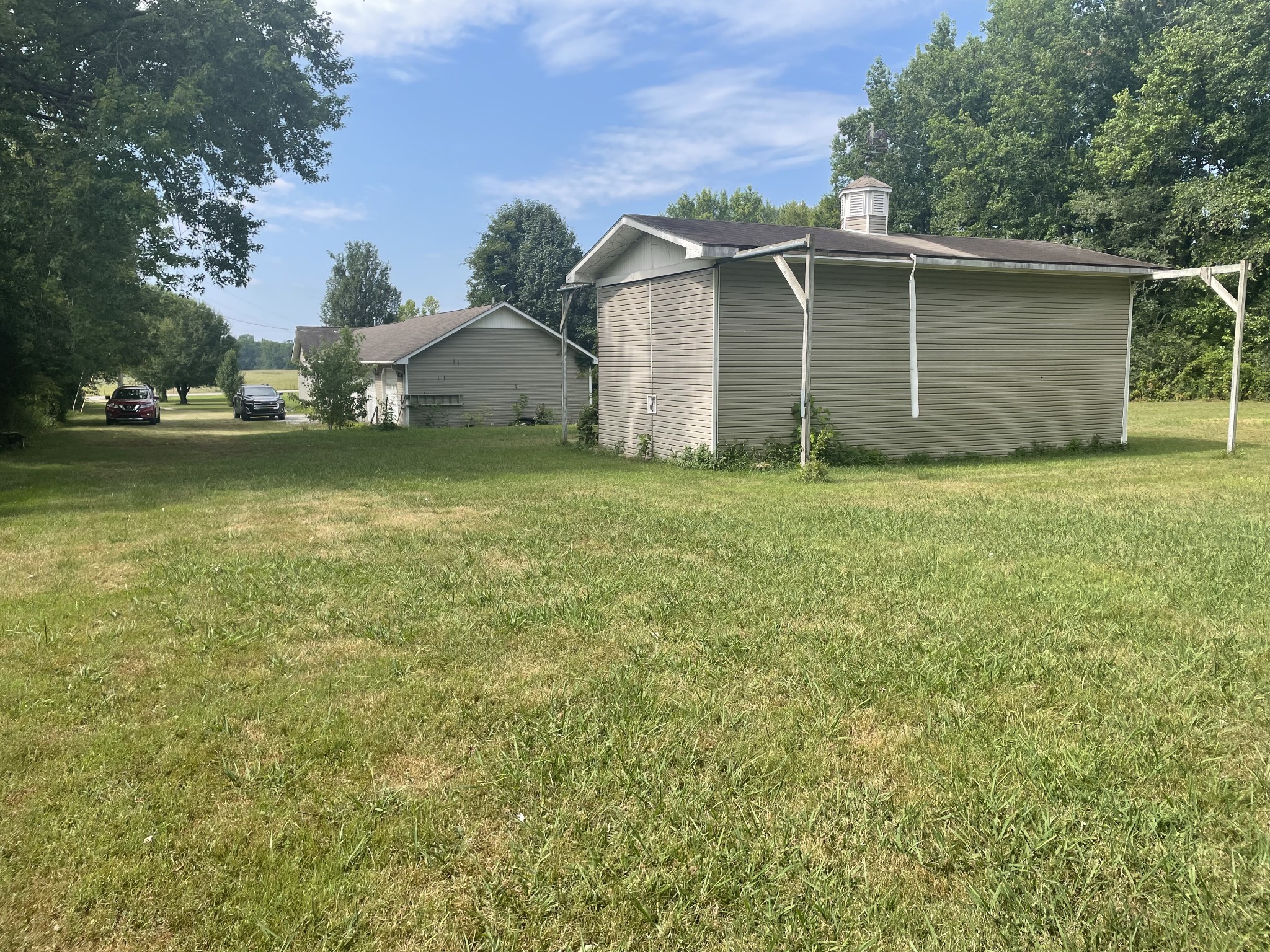 1799 Ragsdale Road Manchester, TN 37355 - Photo 11 of 17 a backyard of a house with lots of green space