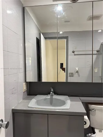 a bathroom with a shower and a toilet