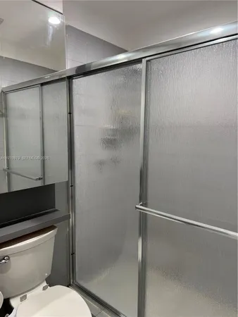 a view of an empty room with windows