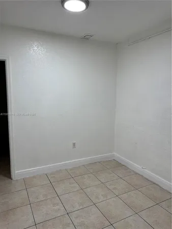 a kitchen with a stove and a microwave