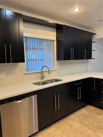 a view of a livingroom with an empty space and a window