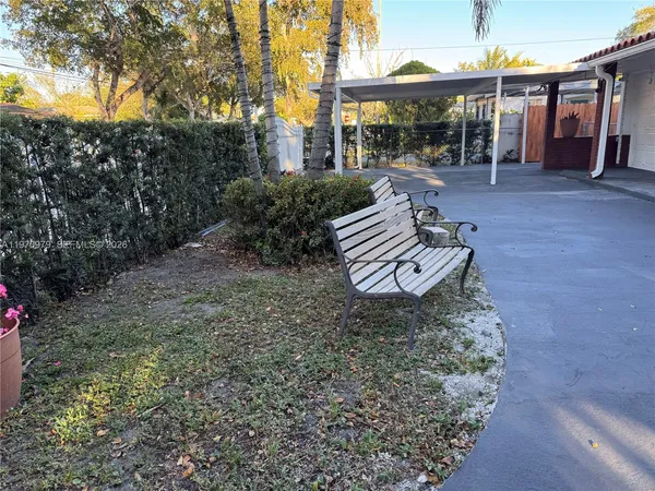a view of a house with a patio and a table
