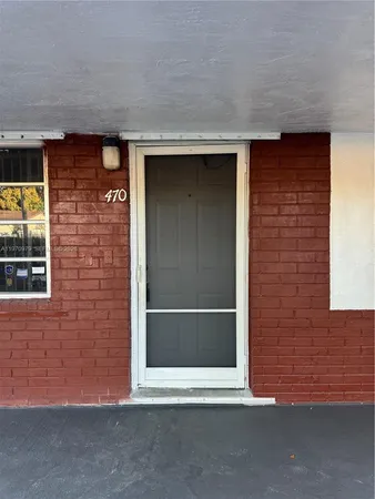 a view of a room with wooden walls and roof