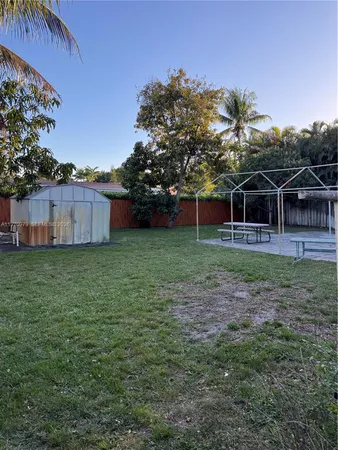 a backyard of a house with lots of green space