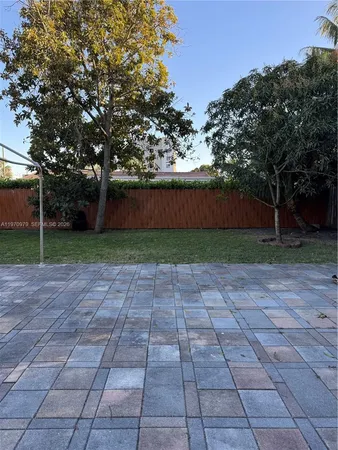 a view of a house with backyard porch and sitting area