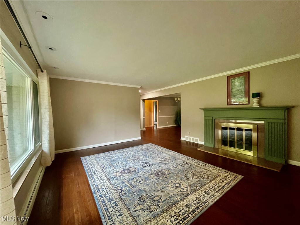 3009 Chamberlain Road Akron, OH 44333 - Photo 3 of 20 The Living Room is so welcoming with the Large Picture Window and attractive and functional fireplace leading effortless to Kitchen and other areas of the home.