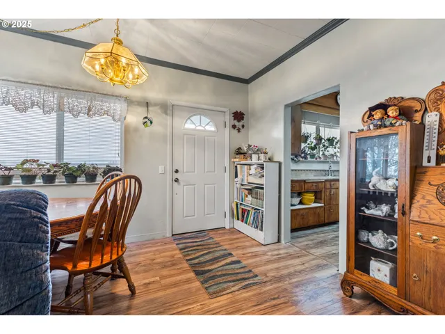 a view of a livingroom with furniture and a window