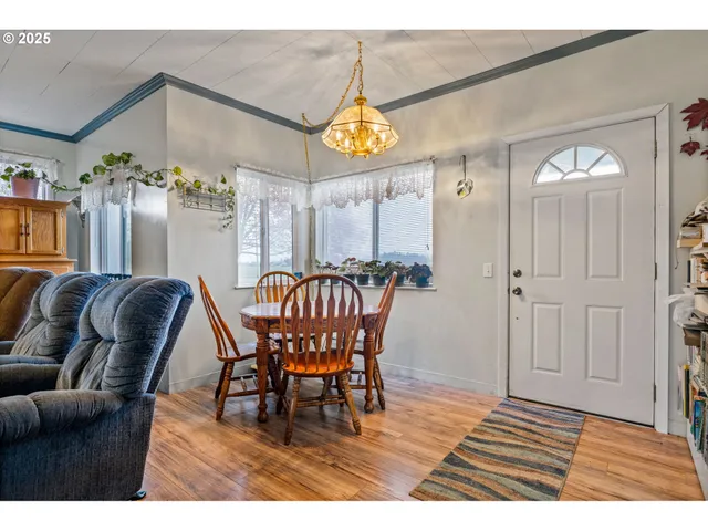 a view of a livingroom with furniture and wooden floor