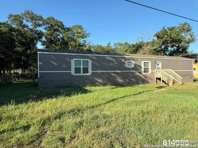 front view of house with a yard