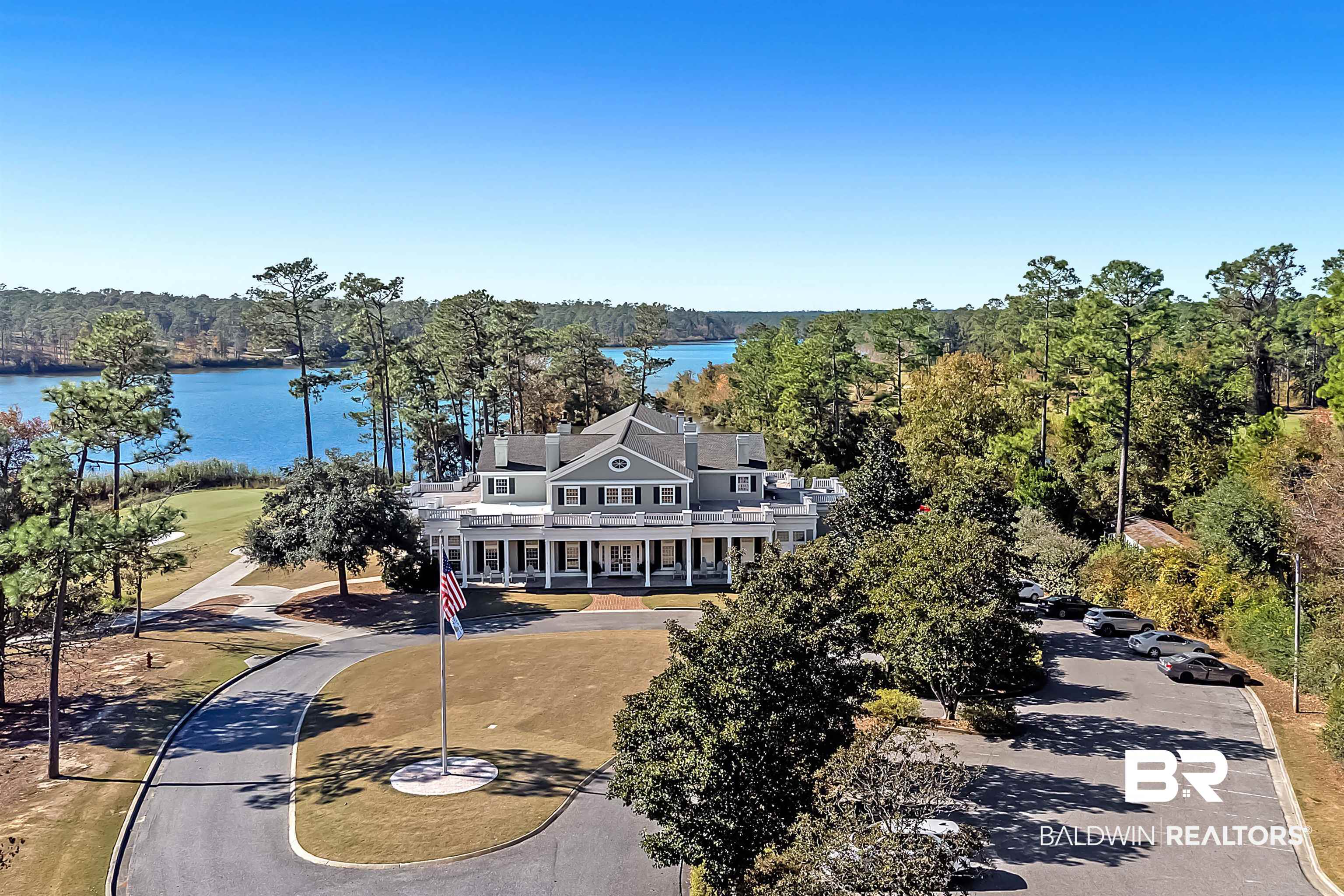 32760 Steelwood Ridge Road, Unit 7 Loxley, AL 36551 - Photo 59 of 64 Drone / aerial view of a large body of water and a forest