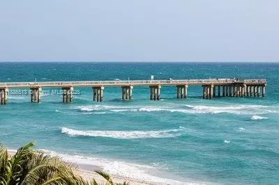 a view of house with a big yard