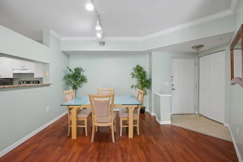 a view of a dining room with furniture and wooden floor