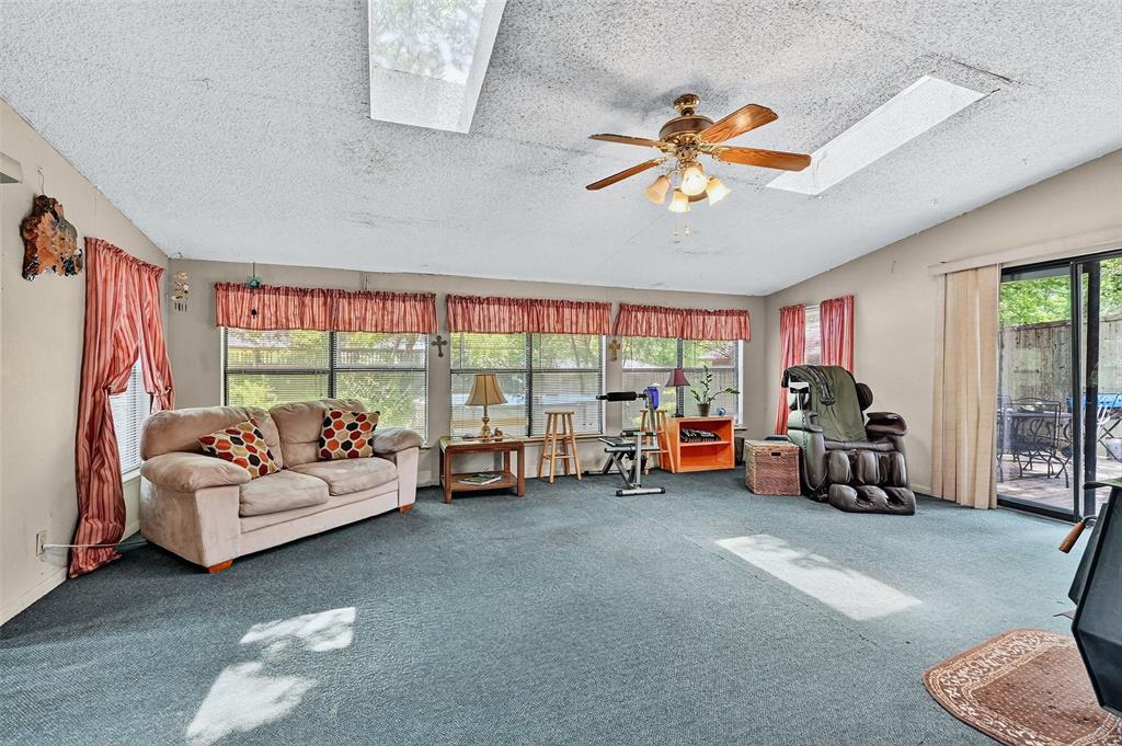 164 Ash Denison, TX 75020 - Photo 10 of 29 a living room with furniture and a large window