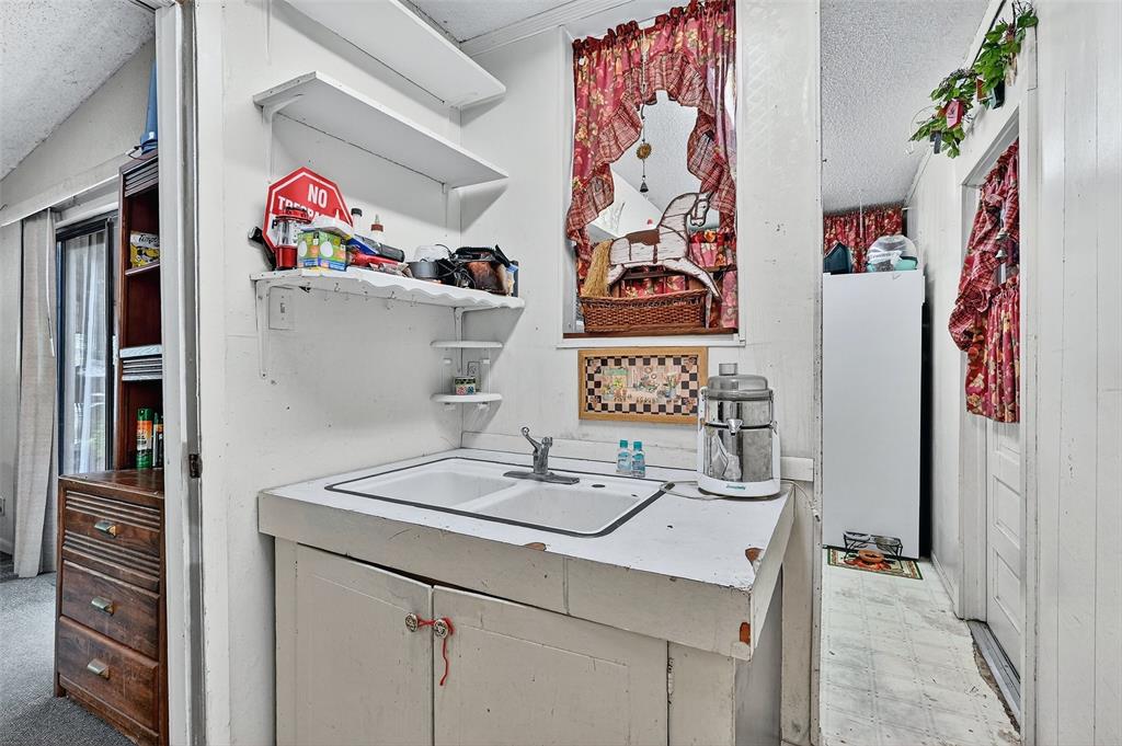 164 Ash Denison, TX 75020 - Photo 13 of 29 a room with storage and utility