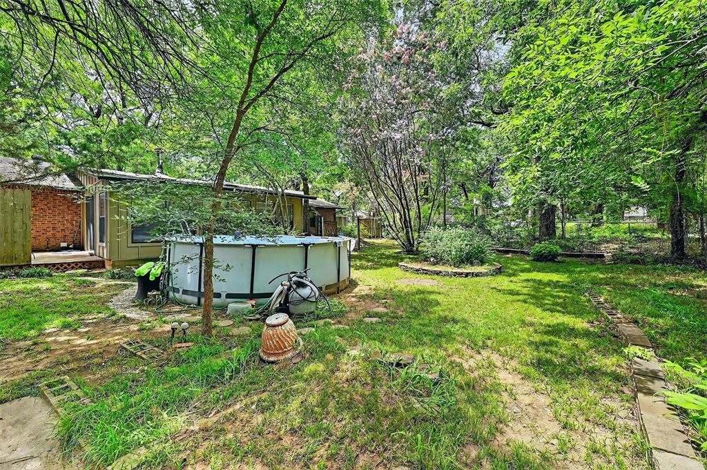 164 Ash Denison, TX 75020 - Photo 26 of 29 a view of a chair and table in backyard of the house