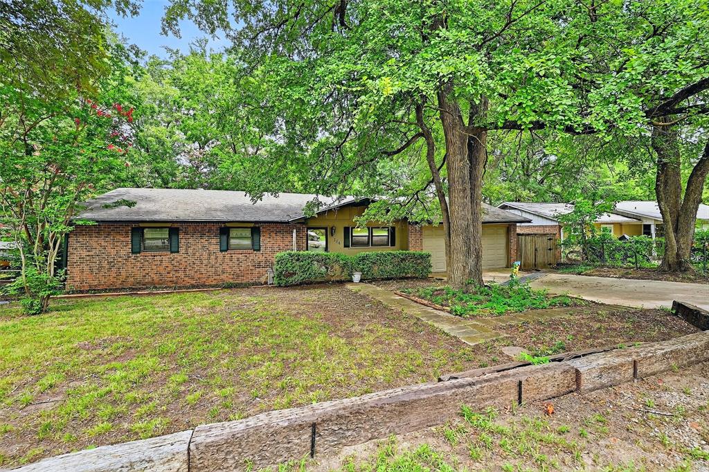 164 Ash Denison, TX 75020 - Photo 3 of 29 a front view of a house with garden
