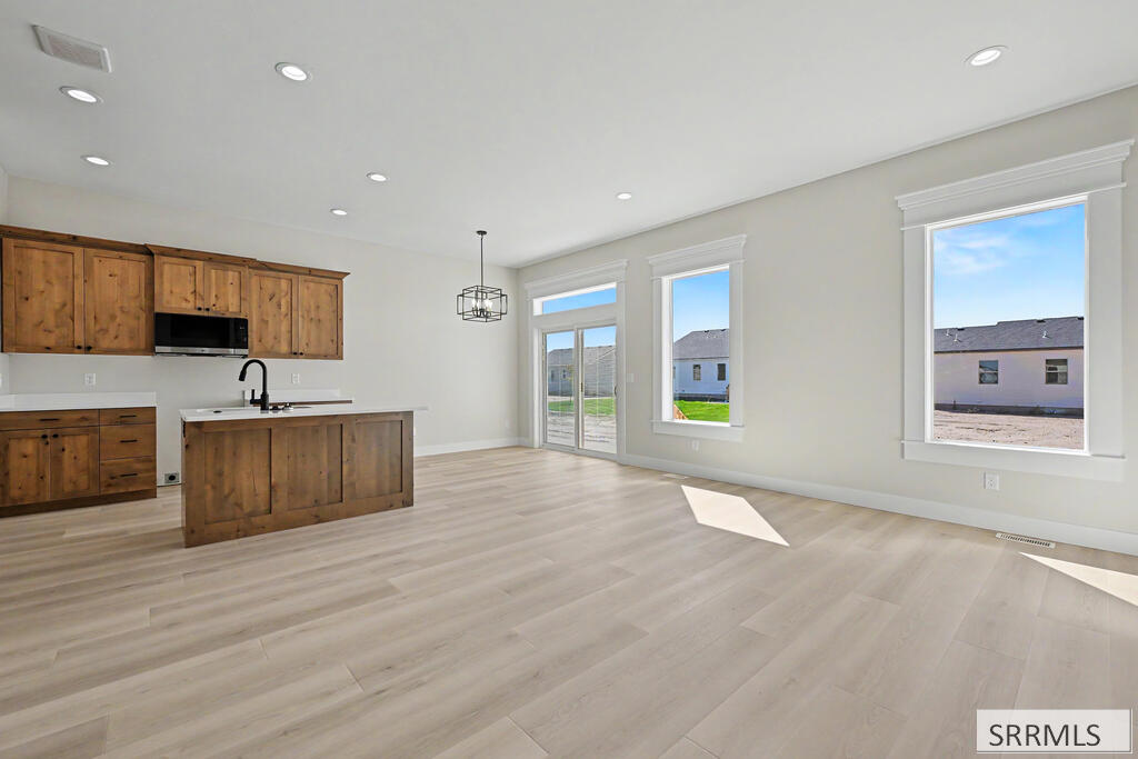 3116 Blue Muse Road Ammon, ID 83406 - Photo 2 of 14 Great Room to Kitchen/Dining Area