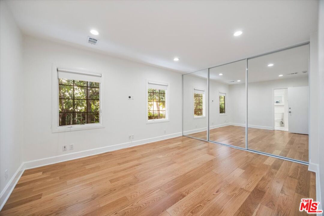14041 Roblar Road Sherman Oaks, CA 91423 - Photo 21 of 47 a view of an empty room with window and wooden floor
