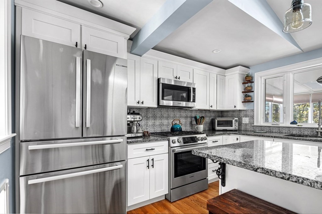 103 Newport Road Hull, MA 02045 - Photo 11 of 40 a kitchen with a refrigerator stove and microwave