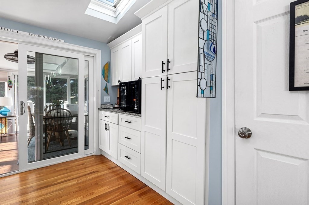 103 Newport Road Hull, MA 02045 - Photo 15 of 40 a kitchen with a refrigerator and a stove top oven
