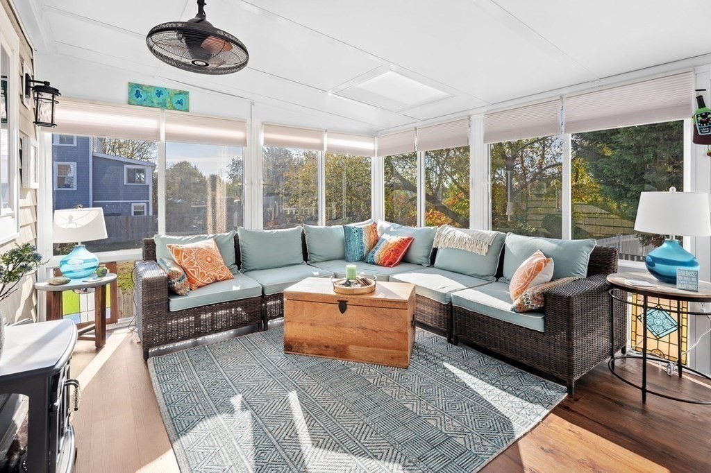 103 Newport Road Hull, MA 02045 - Photo 16 of 40 a living room with furniture ceiling fan and a large window