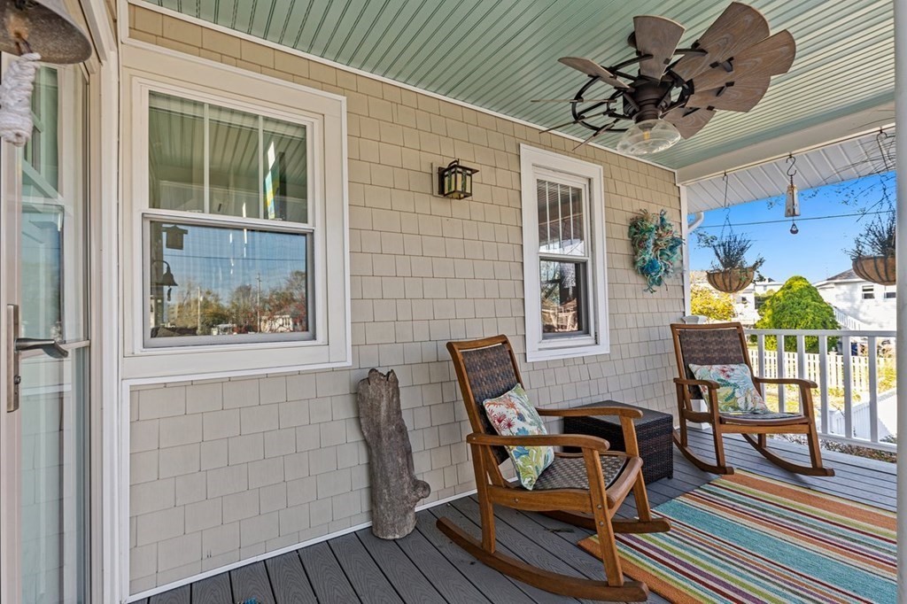 103 Newport Road Hull, MA 02045 - Photo 2 of 40 a view of a patio with table and chairs and potted plants