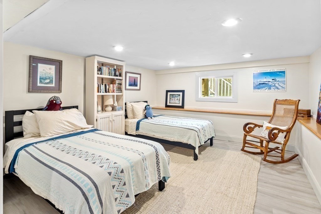 103 Newport Road Hull, MA 02045 - Photo 27 of 40 a spacious bedroom with two beds and a desk