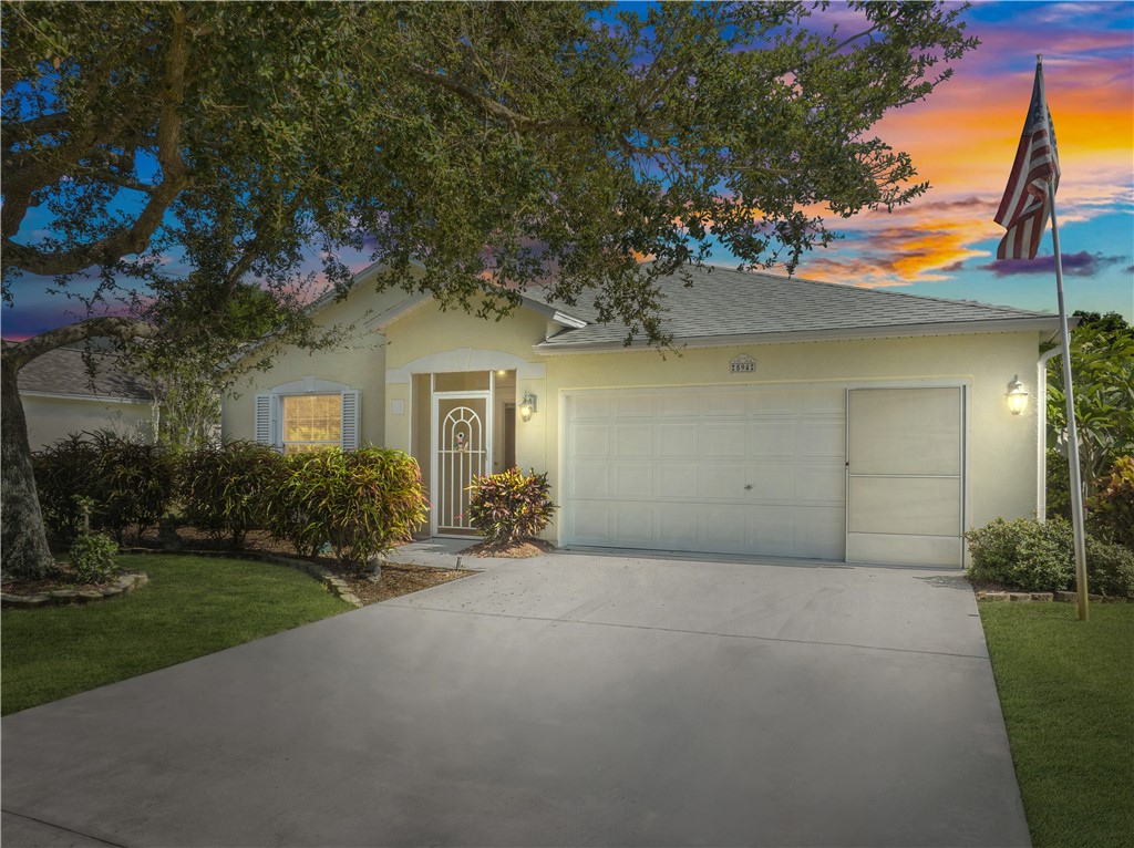 594 Cottonwood Road Sebastian, FL 32958 - Photo 1 of 27 a view of a house with a yard and potted plants