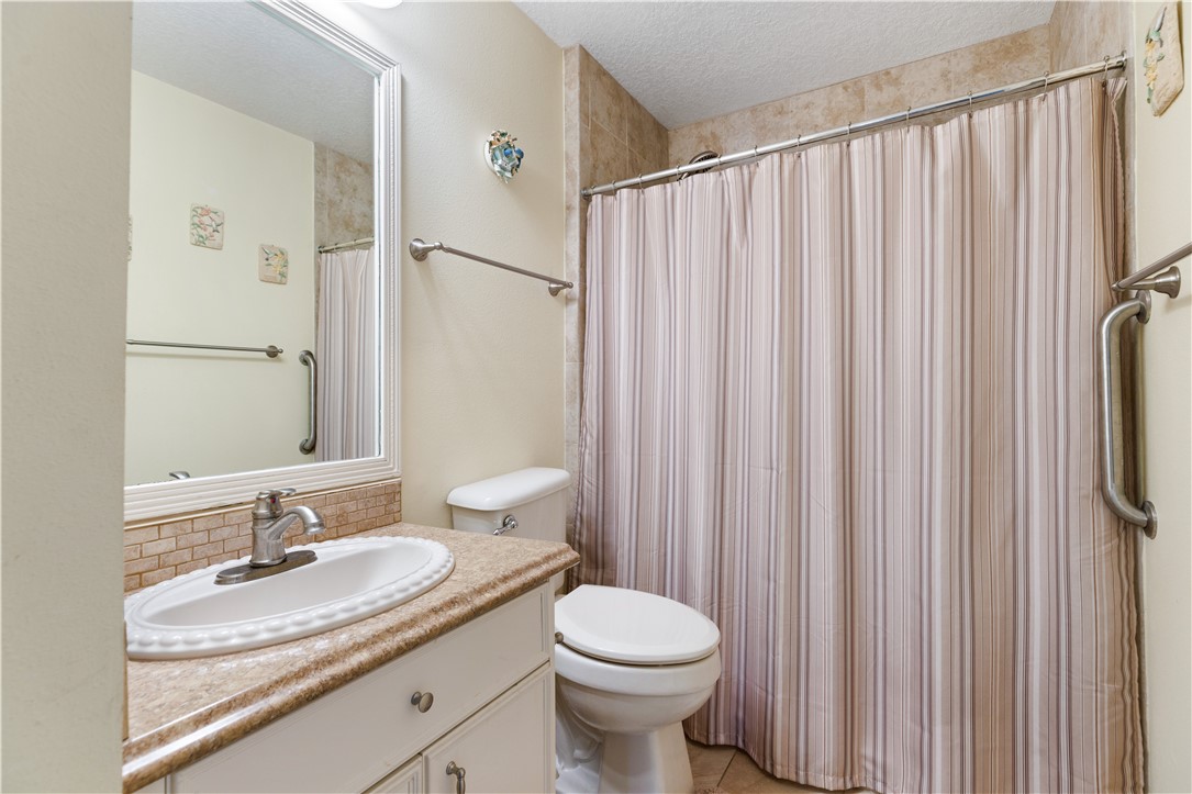 594 Cottonwood Road Sebastian, FL 32958 - Photo 12 of 27 a bathroom with a granite countertop sink and a mirror