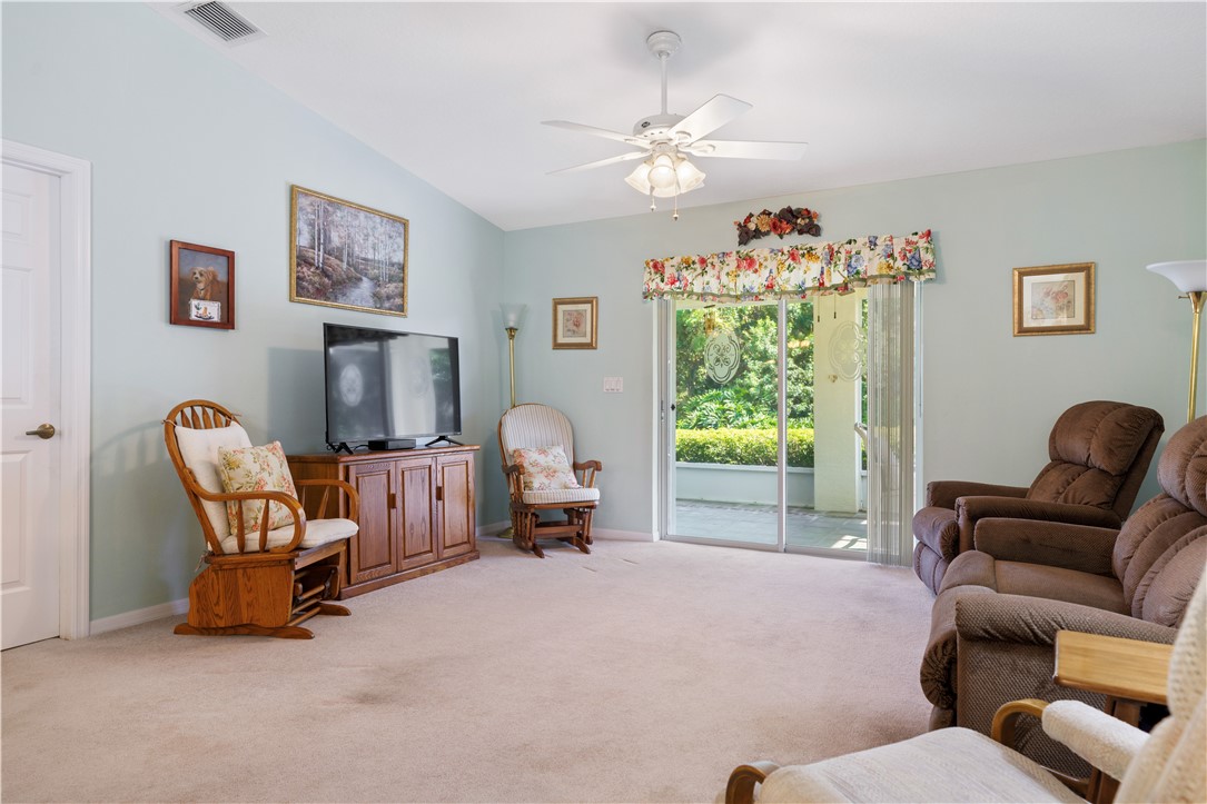 594 Cottonwood Road Sebastian, FL 32958 - Photo 16 of 27 a living room with furniture and a large window