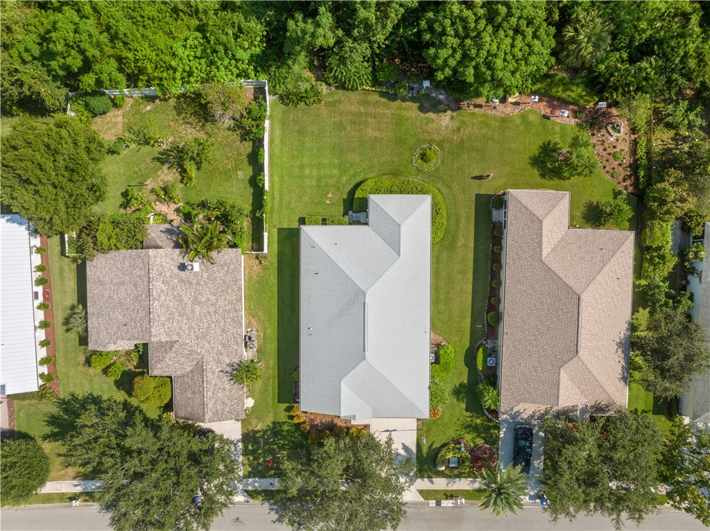 594 Cottonwood Road Sebastian, FL 32958 - Photo 22 of 27 an aerial view of a house with outdoor space and a lake view