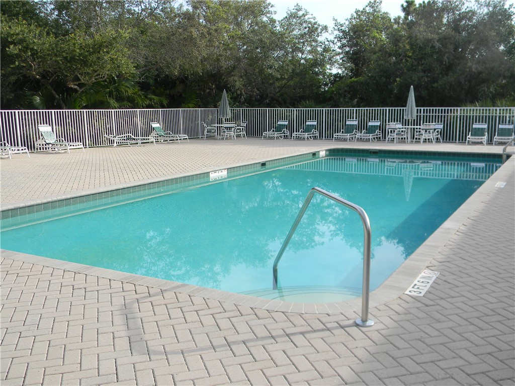 594 Cottonwood Road Sebastian, FL 32958 - Photo 25 of 27 a view of a swimming pool with a backyard