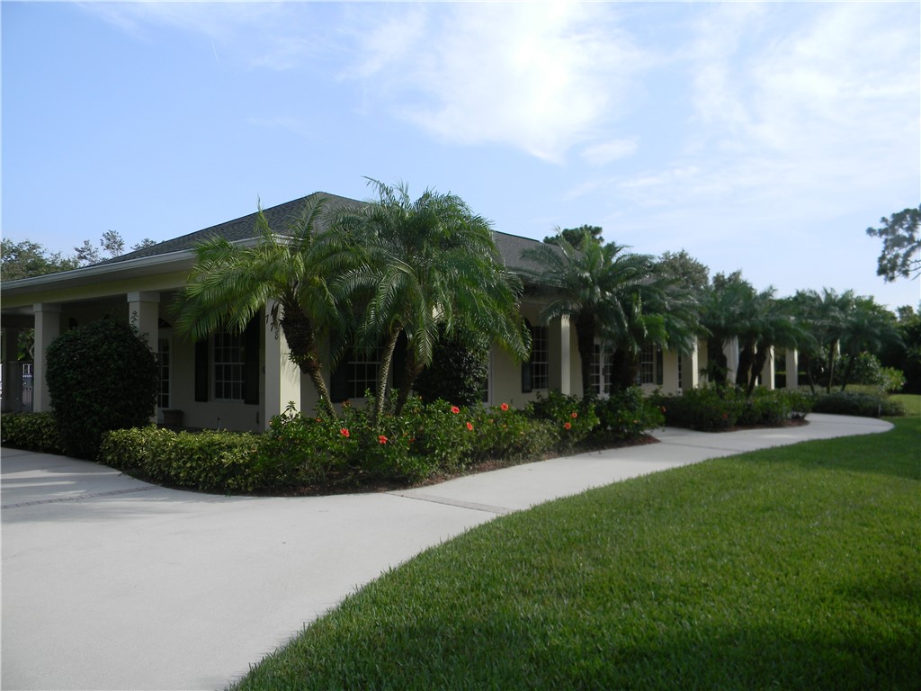 594 Cottonwood Road Sebastian, FL 32958 - Photo 27 of 27 a front view of a house with garden