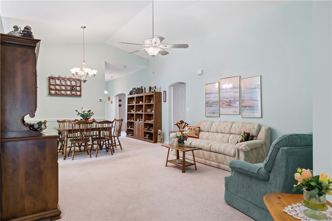 594 Cottonwood Road Sebastian, FL 32958 - Photo 6 of 27 a living room with furniture and a chandelier
