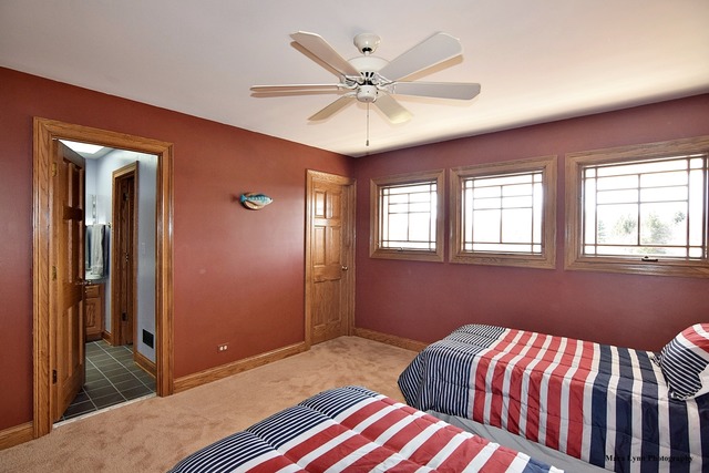 32W546 Rochefort Lane Wayne, IL 60184 - Photo 13 of 25 a bedroom with a bed and a chandelier