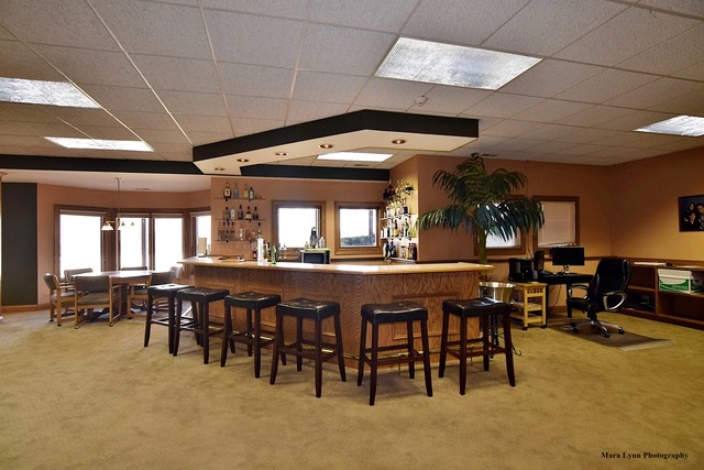 32W546 Rochefort Lane Wayne, IL 60184 - Photo 18 of 25 a dining hall with furniture a rug and a projector