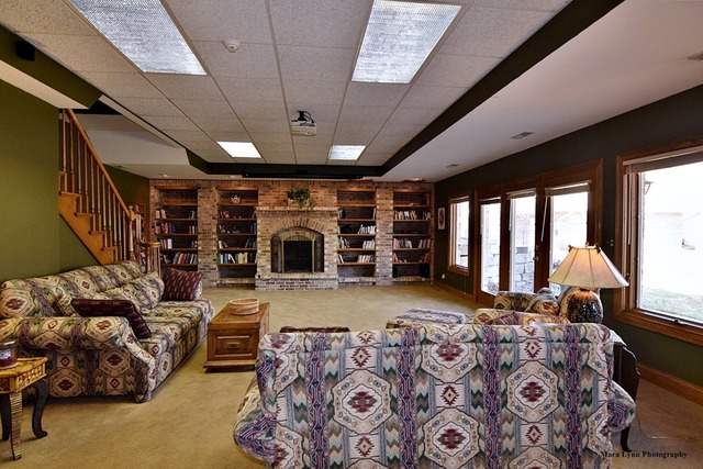 32W546 Rochefort Lane Wayne, IL 60184 - Photo 20 of 25 a living room with furniture large window and a fireplace
