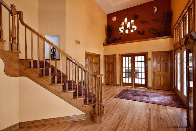 32W546 Rochefort Lane Wayne, IL 60184 - Photo 3 of 25 a view of a livingroom with wooden floor and stairs