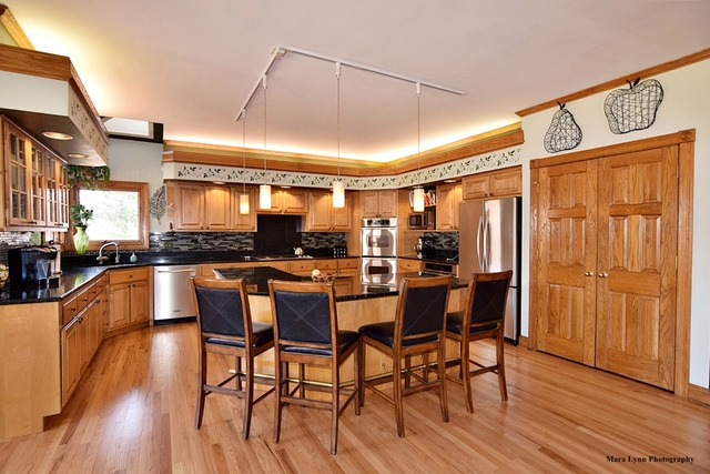 32W546 Rochefort Lane Wayne, IL 60184 - Photo 6 of 25 a dining table with chairs and wooden floor
