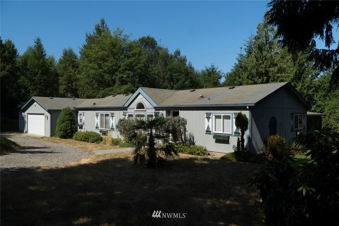 465 Guy Kelly Road Port Angeles, WA 98362 - Photo 2 of 31 a house view with a garden space