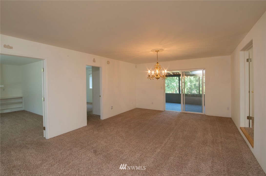 465 Guy Kelly Road Port Angeles, WA 98362 - Photo 11 of 31 an empty room with windows and outdoor view