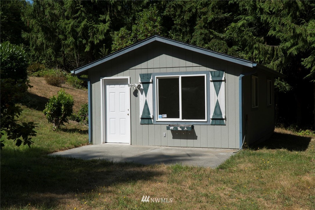 465 Guy Kelly Road Port Angeles, WA 98362 - Photo 24 of 31 a front view of a house with a yard