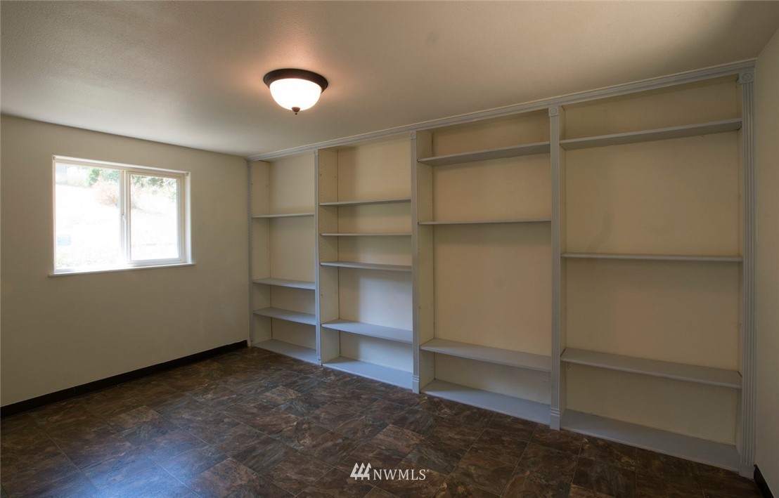 465 Guy Kelly Road Port Angeles, WA 98362 - Photo 26 of 31 a view of an empty room with a window