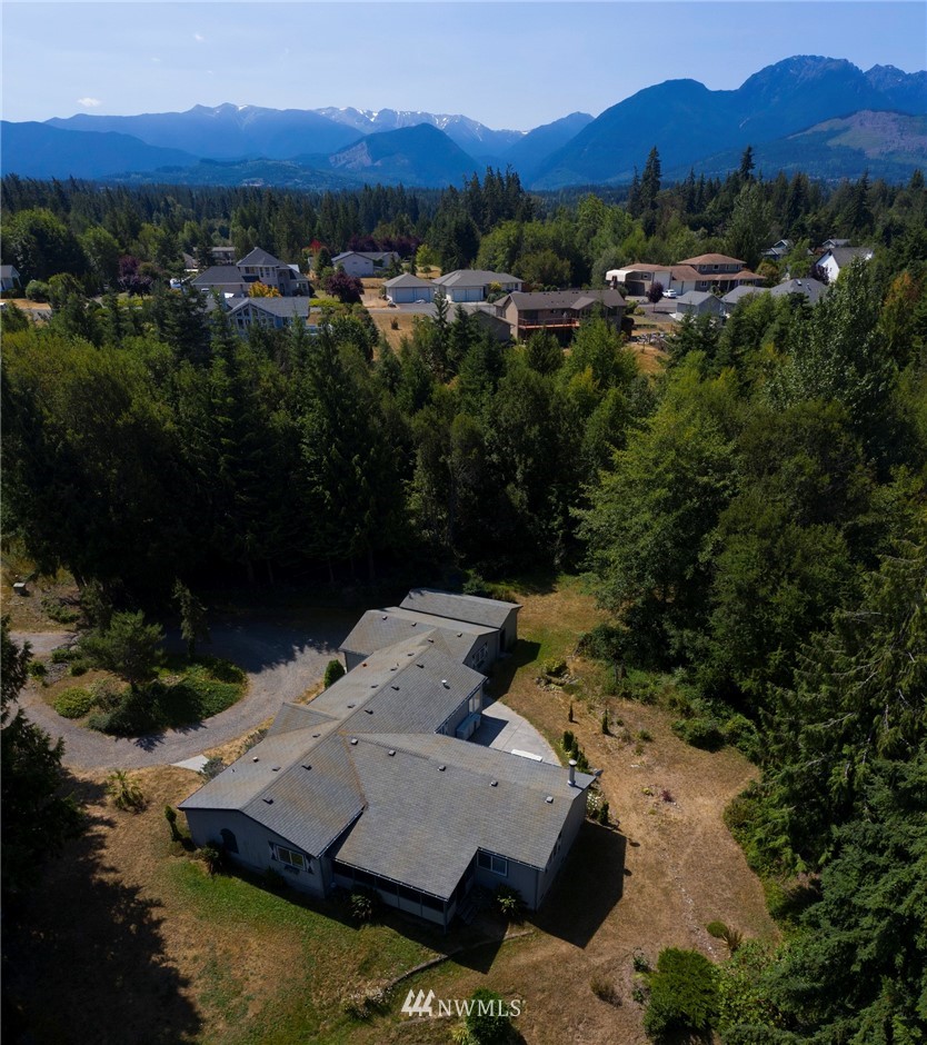 465 Guy Kelly Road Port Angeles, WA 98362 - Photo 30 of 31 an aerial view of a house with mountain view