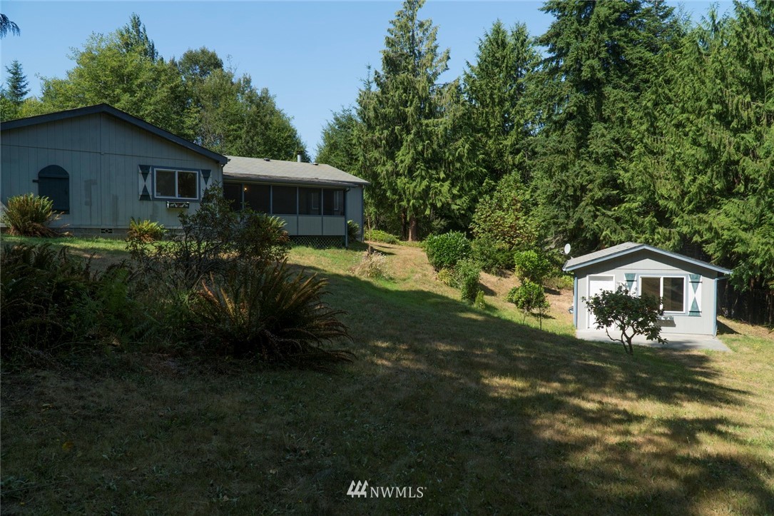 465 Guy Kelly Road Port Angeles, WA 98362 - Photo 4 of 31 a front view of a house with a yard