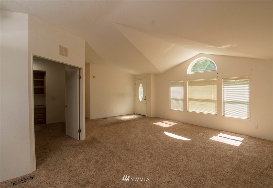 465 Guy Kelly Road Port Angeles, WA 98362 - Photo 5 of 31 a view of an empty room with a window