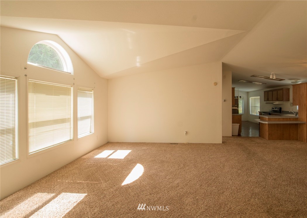 465 Guy Kelly Road Port Angeles, WA 98362 - Photo 6 of 31 a view of an empty room with a window