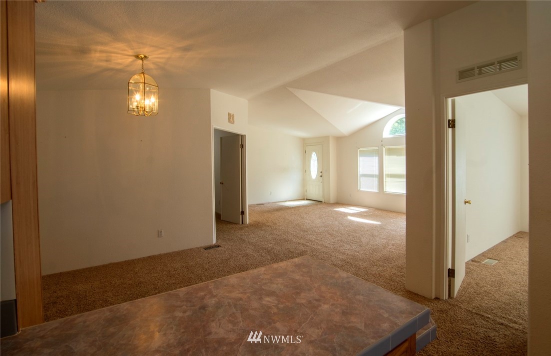 465 Guy Kelly Road Port Angeles, WA 98362 - Photo 7 of 31 a view of empty room with wooden floor